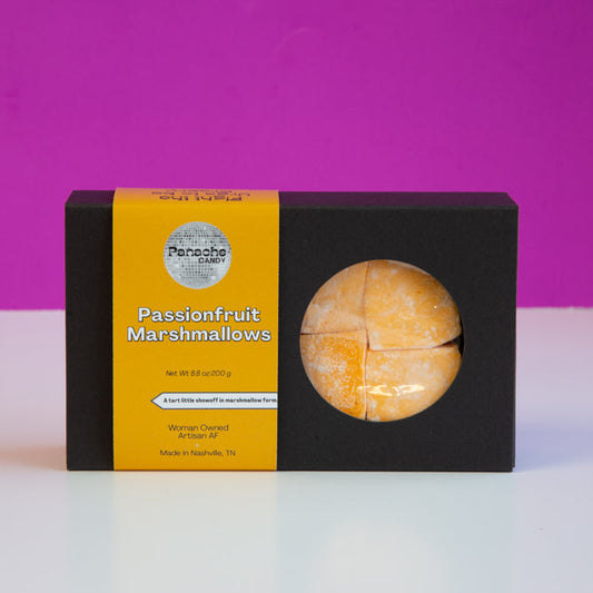 Box of passionfruit marshmallows with a purple background